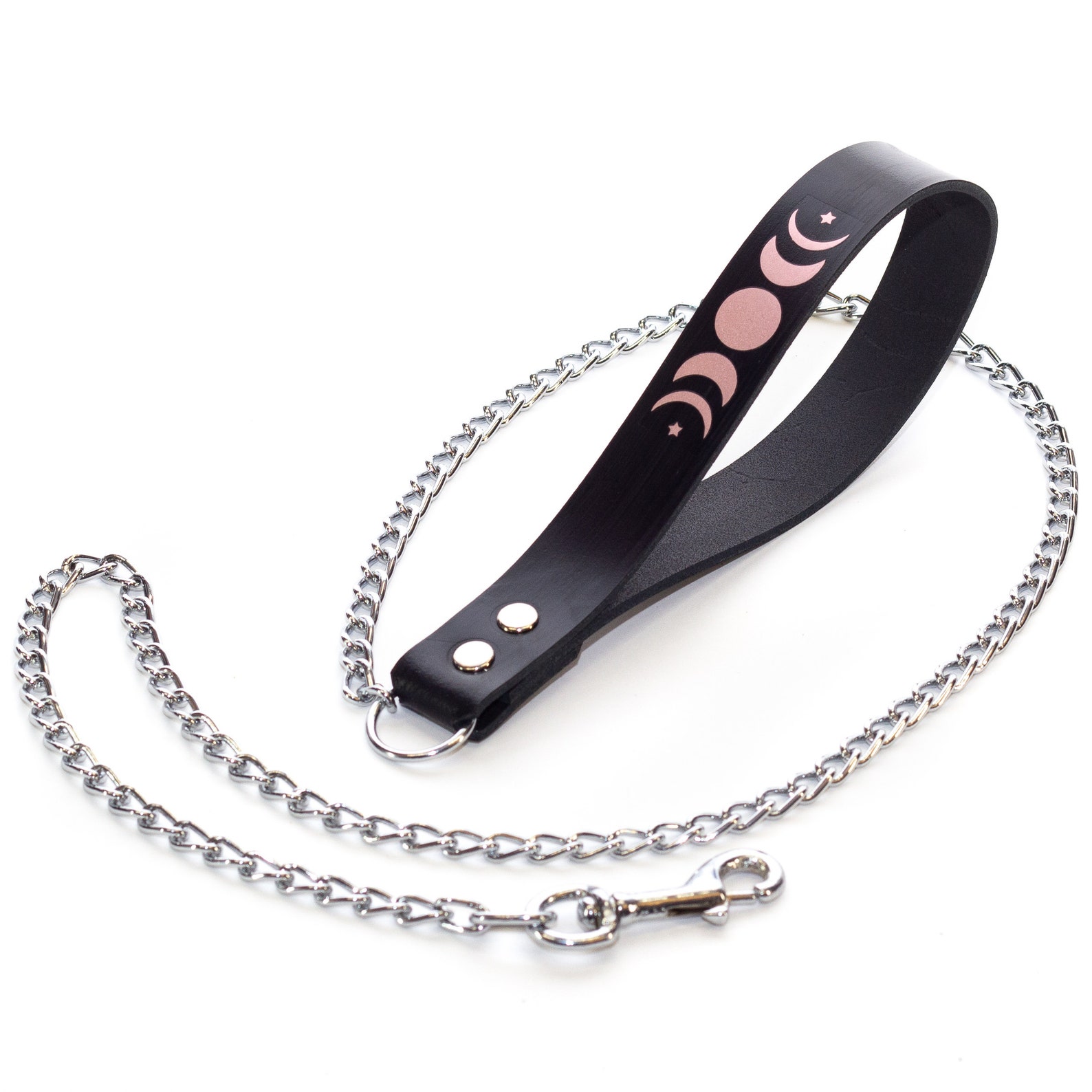 Close-up of black leather leash with pink moon phase design and silver chain, part of BDSM bondage restraint set.