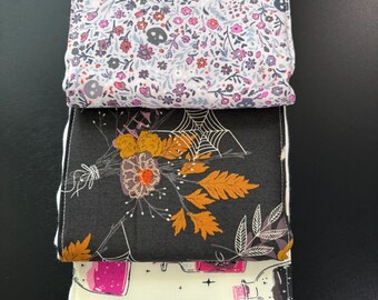 Burp cloths, potions, skulls, bones, spider webs, witches, flowers, baby shower