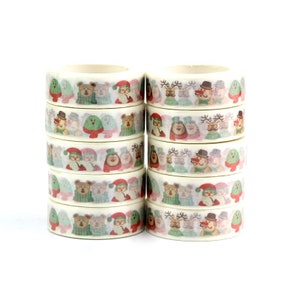 May include: A stack of ten rolls of white washi tape with a Christmas theme. Each roll features a different design with cute cartoon characters like bears, reindeer, and Santa Claus wearing hats and scarves. The designs are in shades of red, green, and brown.