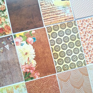 Könnte beinhalten: Ein Set mit 10 gemusterten Scrapbook-Papierbögen mit verschiedenen Designs, darunter Blumen, Noten, Uhren und geometrische Muster. Das Papier ist in Braun-, Beige- und Cremetönen gehalten.