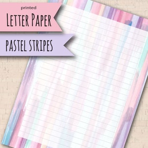May include: Printable letter paper with pastel colored stripes. The paper has a light pink, light blue, and light purple watercolor background with white lines.
