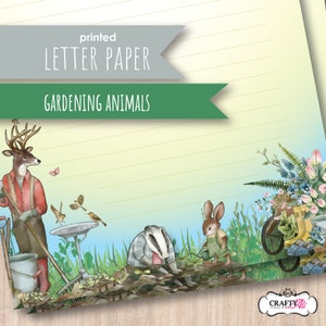 May include: Printed letter paper with the text "Gardening Animals." The illustration features a deer, badger, and rabbit dressed in gardening attire. A wheelbarrow filled with flowers and gardening tools is also shown. The paper has a lined design.
