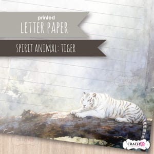 May include: A sheet of lined letter paper featuring a watercolor illustration of a white tiger resting on a dark log. The top of the page displays two grey banners with the text printed LETTER PAPER and SPIRIT ANIMAL: TIGER in white font.