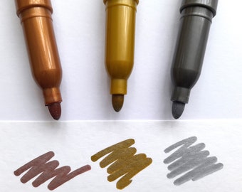 Set of 3 metallic marker pens with silver, gold and bronze ink, removable cap with clasp