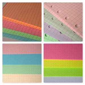 May include: A stack of colorful paper with different patterns. The paper is lined, gridded, and dotted. The paper is perfect for note-taking, journaling, and crafting.