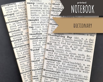 May include: A vintage brown notebook with the words "printed notebook dictionary" on the front cover. The notebook is open to a page with a definition for "Thanksgiving Day".