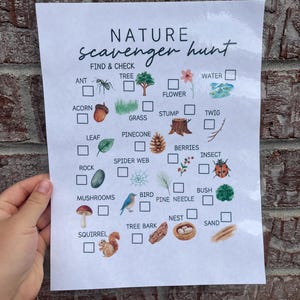 May include: A printed nature scavenger hunt checklist with watercolor illustrations of natural elements like a tree, acorn, and bird. The title "NATURE scavenger hunt" is at the top, with check boxes next to each item.
