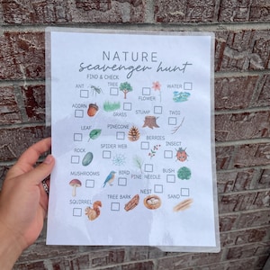 May include: A nature scavenger hunt checklist with illustrations of natural items like an ant, tree, acorn, leaf, rock, mushrooms, squirrel, flower, grass, stump, twig, pinecone, spider web, berries, insect, bird, pine needle, bush, nest, and sand.