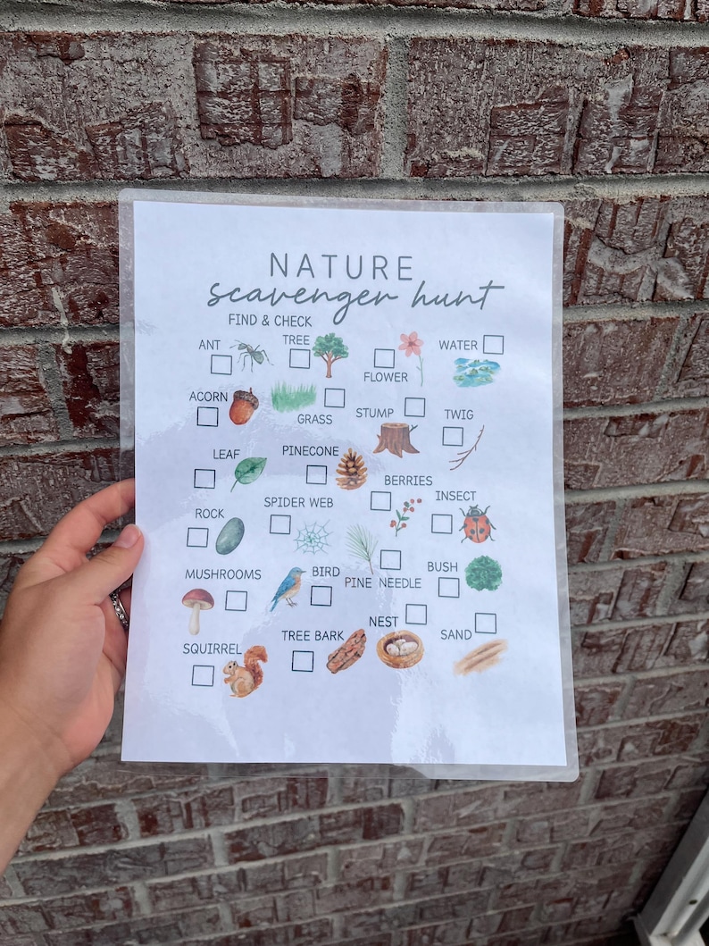 May include: A nature scavenger hunt checklist with illustrations of natural items like an ant, tree, acorn, leaf, rock, mushrooms, squirrel, flower, grass, stump, twig, pinecone, spider web, berries, insect, bird, pine needle, bush, nest, and sand.