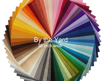 May include: A fan-shaped arrangement of 36-inch wide felt fabric in various colors, including red, orange, yellow, green, blue, purple, and brown. The text "By the Yard" and "36 inch wide" is printed in black on a white background.