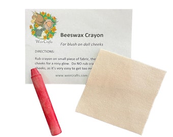 May include: A red beeswax crayon for adding blush to doll cheeks. The package includes directions for use and a website address.