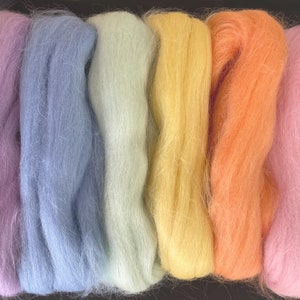 May include: Six skeins of wool yarn in various pastel colors, including lavender, light blue, pale green, yellow, peach, and pink.