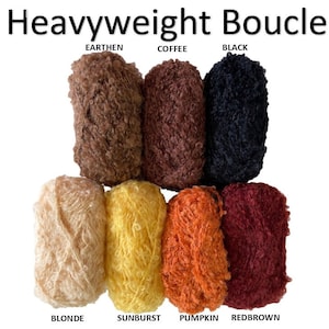 May include: Eight skeins of heavyweight boucle yarn in various colors: Earthen, Coffee, Black, Blonde, Sunburst, Pumpkin, and Redbrown.