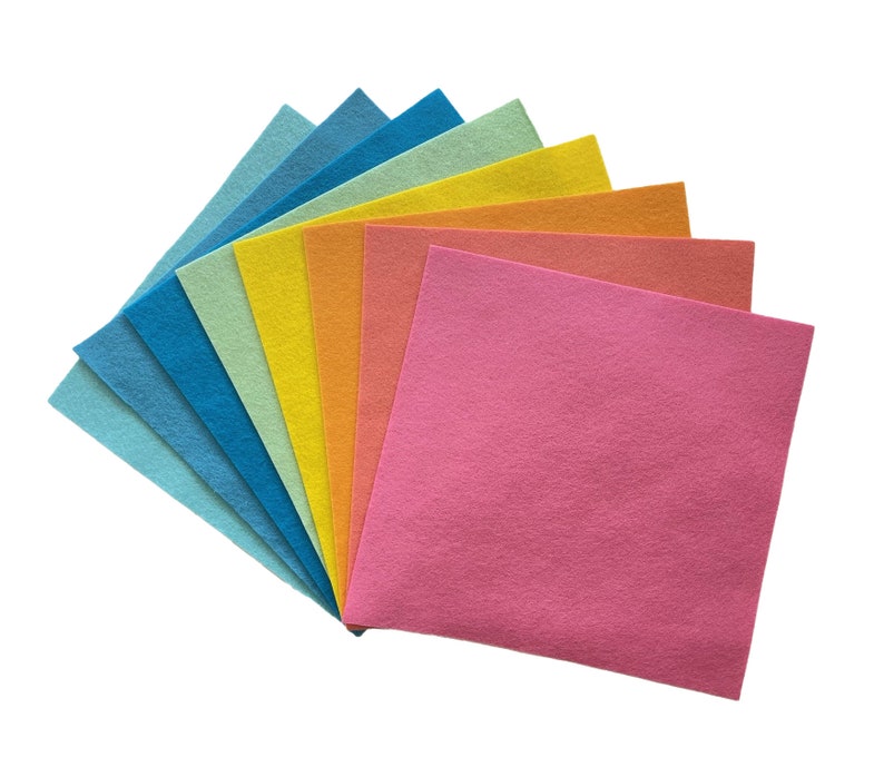 May include: A set of ten felt sheets in various colors, including blue, green, yellow, orange, and pink. The sheets are arranged in a fan shape, with the pink sheet on top.