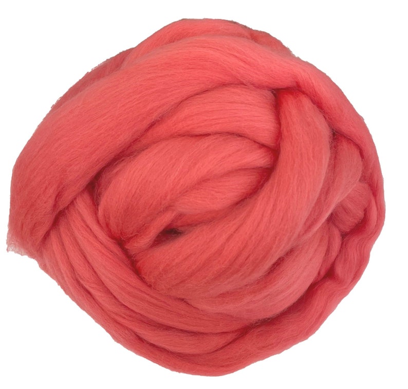 May include: A large ball of coral-colored wool yarn. The yarn is soft and fluffy, and it is perfect for knitting or crocheting.