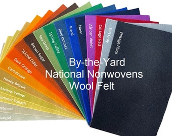 May include: A fan of 16 different colors of wool felt, labeled with names like "Vintage Black", "Earl Gray", "Cottage Red", "African Violet", "Navy", "Royal", "Blue Bonnet", "Spring Valley", "Sea Grass", "Brown Sugar", "Spiced Cider", "Dark Orange", "Cantaloupe", "Honey Biscuit", "Mellow Yellow", "Summer Squash", "Oatmeal", and "Natural". The text "By-the-Yard National Nonwovens Wool Felt" is printed in the center of the fan.