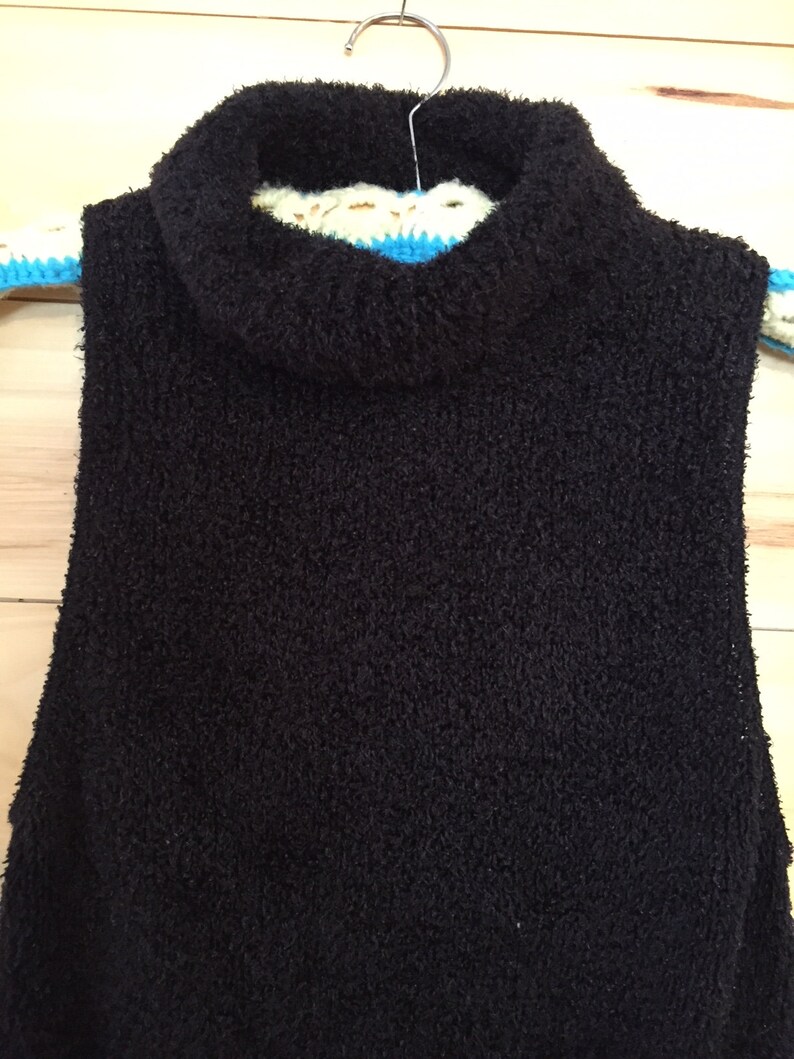 fuzzy sleeveless turtleneck