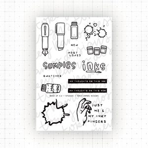May include: A clear photopolymer stamp set featuring black line art illustrations of fountain pens, ink bottles, ink splatters, and a hand. Text includes "SAMPLES INKS", "NEW", "MOST LOVED", "SWATCHES", "MY THOUGHTS ON THIS INK", and "JUST ME & MY INKY FINGERS".