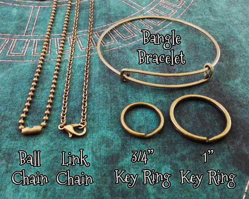 May include: Four different types of metal chains and two key rings. The chains are ball chain, link chain, bangle bracelet, 3/4 inch key ring, and 1 inch key ring.