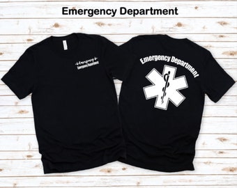 May include: Black t-shirt with a white medical symbol and the text "Emergency Department" on the back. The front of the shirt has a smaller white text that reads "Emergency Department" with a heartbeat symbol.