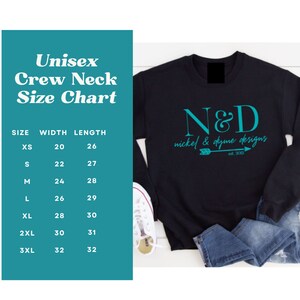 May include: A black crew neck sweatshirt with a teal blue graphic design that says "N&D nickel & dyme designs est. 2013". A size chart is included with measurements in inches for XS, S, M, L, XL, 2XL, and 3XL.