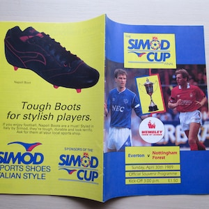 May include: A yellow and blue program for the Simod Cup Final, a soccer match between Everton and Nottingham Forest. The program features a photo of the trophy and the two teams' players. The program is dated Sunday, April 30th, 1989, and costs £1.50.