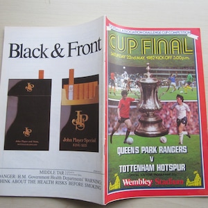 May include: A vintage program for the 1982 Football Association Challenge Cup Final between Queens Park Rangers and Tottenham Hotspur. The program features a photo of the trophy and the two teams playing at Wembley Stadium. The program is sponsored by John Player Special cigarettes.