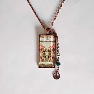 Beautiful Butterfly 1x2 Inch Glass Pendant Necklace in Antique Copper with Peace Charm on 22 Inch Chain