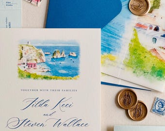 May include: Wedding invitation suite featuring a watercolor illustration of a coastal scene. The invitation includes the names "Tilda Keci and Steven Wallace" and event details. Includes blue envelopes, stamps, and gold wax seals.