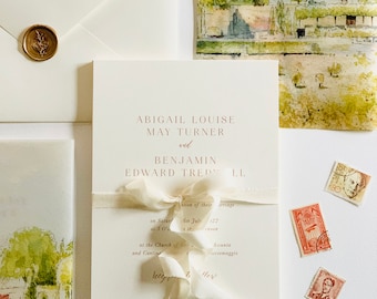 May include: A wedding invitation with a watercolor illustration of a building and a ribbon tied around the invitation. The invitation reads "Abigail Louise May Turner and Benjamin Edward Tred LL" and includes the date and location of the wedding.