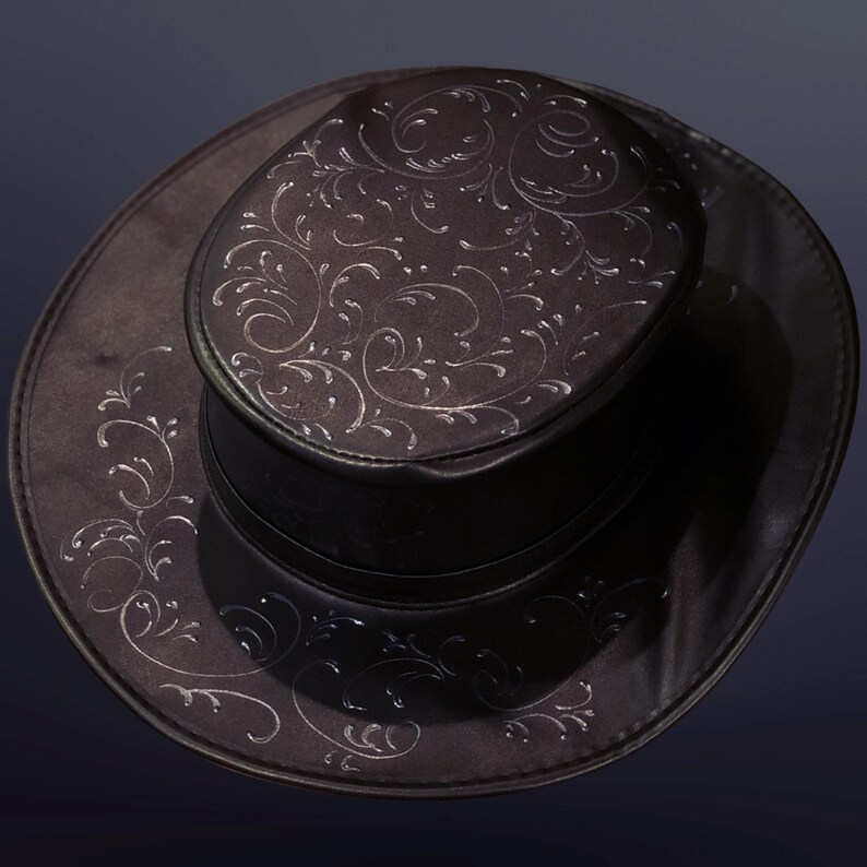May include: A black leather cowboy hat with a silver floral design.