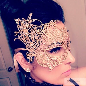 masquerade mask woman in elegant gold Lace studded with rhinestones for venetian ball, mardi gras, prom weddings parties