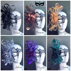 May include: Six masquerade masks with different colored feathers and flowers. The masks are black with rhinestones and a delicate lace design. The colors of the feathers and flowers are black, brown, yellow, silver, purple, and green.