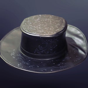 May include: A black leather fedora hat with a decorative embossed floral pattern. The hat has a tall crown and a wide brim.