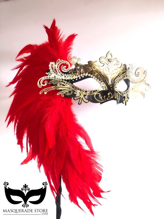 Red Mask with Feathers on a stick Red Mask with Feathers on a stick