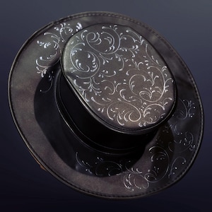 May include: A black leather hat with a silver floral design. The hat has a wide brim and a tall crown.