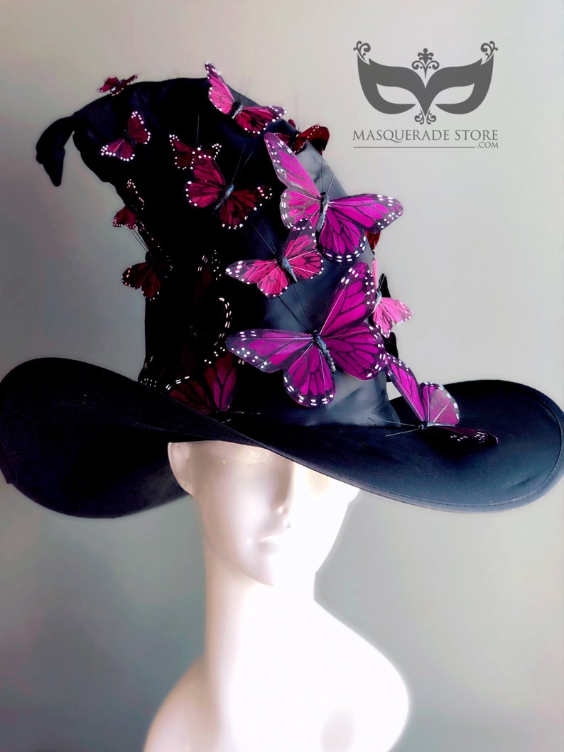 May include: A black witch hat with a wide brim and a tall crown adorned with numerous purple and black butterfly embellishments.