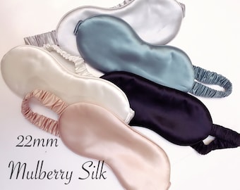 May include: Five silk sleep masks in different colours: light blue, white, beige, black, and grey. The masks are 22mm wide and made of mulberry silk, grade 6A.