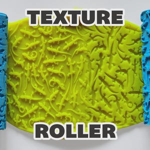 May include: Two cylindrical blue texture rollers with a lizard pattern and a central yellow sheet of material embossed with the same lizard design. The image features the text "TEXTURE ROLLER" in bold white letters with a black outline.