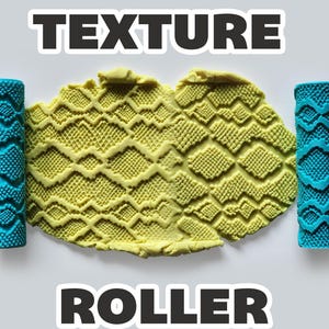 May include: Two bright blue cylindrical texture rollers with a geometric diamond pattern, positioned on either side of a yellow clay slab that displays the same embossed diamond and grid texture. The text "TEXTURE ROLLER" appears in bold black letters.