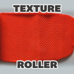 May include: A yellow textured roller tool positioned on both sides of a bright orange slab of clay. The clay features a repeating wavy, grid-like pattern imprinted by the roller. The text "TEXTURE ROLLER" is displayed in white letters.