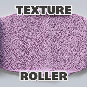 May include: A light blue paint roller with a textured surface positioned on both sides of a central lavender-colored area featuring a rough, uneven finish. The text "TEXTURE ROLLER" is displayed in bold, dark letters at the top and bottom.