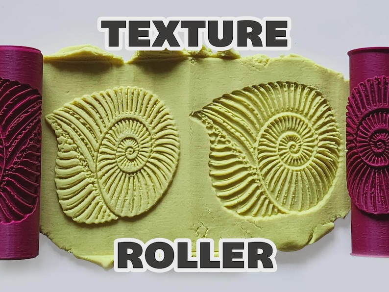 May include: Two magenta cylindrical texture rollers positioned on the sides of a light yellow clay slab. The clay features two embossed ammonite shell patterns created by the rollers. The text "TEXTURE ROLLER" is printed in white letters.