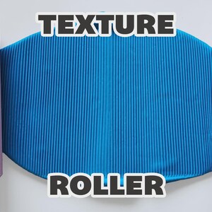 May include: Two cylindrical light purple texture rollers positioned on the left and right sides of a central blue oval sheet with a vertical ribbed pattern. The text "TEXTURE ROLLER" is printed in white with a black outline across the image.