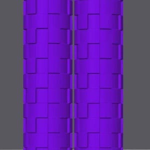 Pu&ograve; includere: Due oggetti cilindrici identici di colore viola vivace, ciascuno caratterizzato da un motivo geometrico ripetitivo di blocchi rettangolari in rilievo disposti in una griglia sfalsata e incastrata sull'intera superficie dei cilindri.