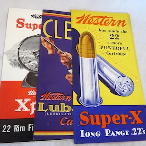 May include: Three vintage advertising brochures for Western Super-X ammunition. The brochures feature bold colors, including red, blue, and yellow, with illustrations of bullets and text such as "Super-X" and "Long Range .22's".