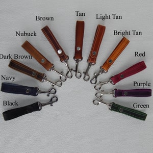 Simple, strong and useful leather loops with a metal spring clip firmly attached.   Current selection shown - Black, Navy, Dark Brown, Tan, Nubuck, Brown, Tan, Light Tan, Bright Tan, Rea, Purple and Green.