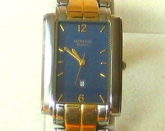 Swiss made Birks Wrist Watch with gold and silver tone link bracelet, in good working order.