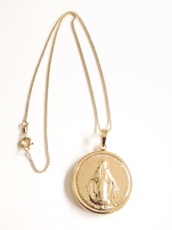 gold necklace with mama mary pendant