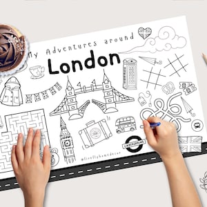 Puede incluir: Página para colorear en blanco y negro con monumentos de Londres, como el Tower Bridge, el Big Ben y un autobús de dos pisos rojo. El texto dice "My Adventures around London". También hay una magdalena y lápices de colores.